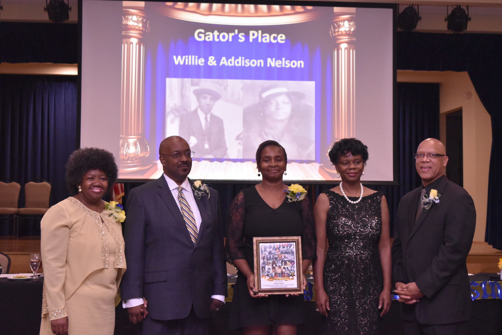 Zalendar Green accepts Legacy Award for Gator's Place.